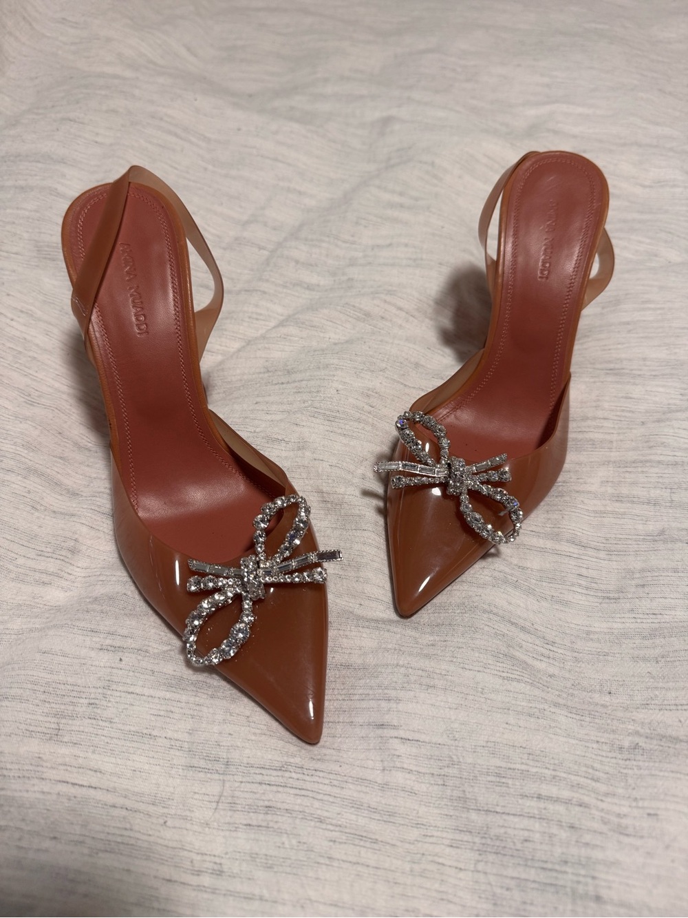 Amina Muaddi Brown Patent Pointed Slingback Heels with Crystal Bow